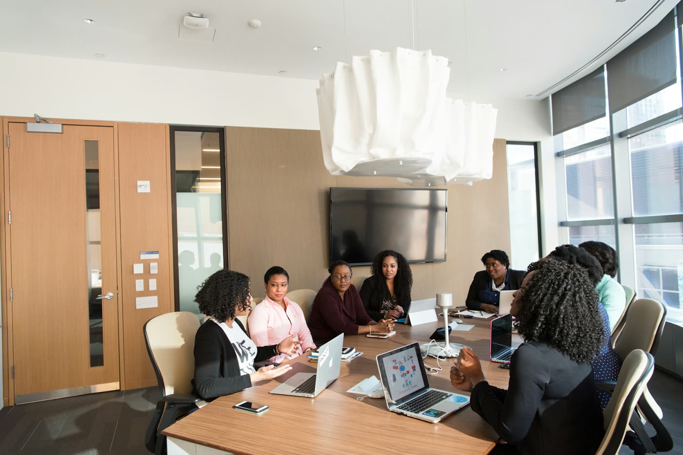 Team gathered around a conference table in a modern meeting room